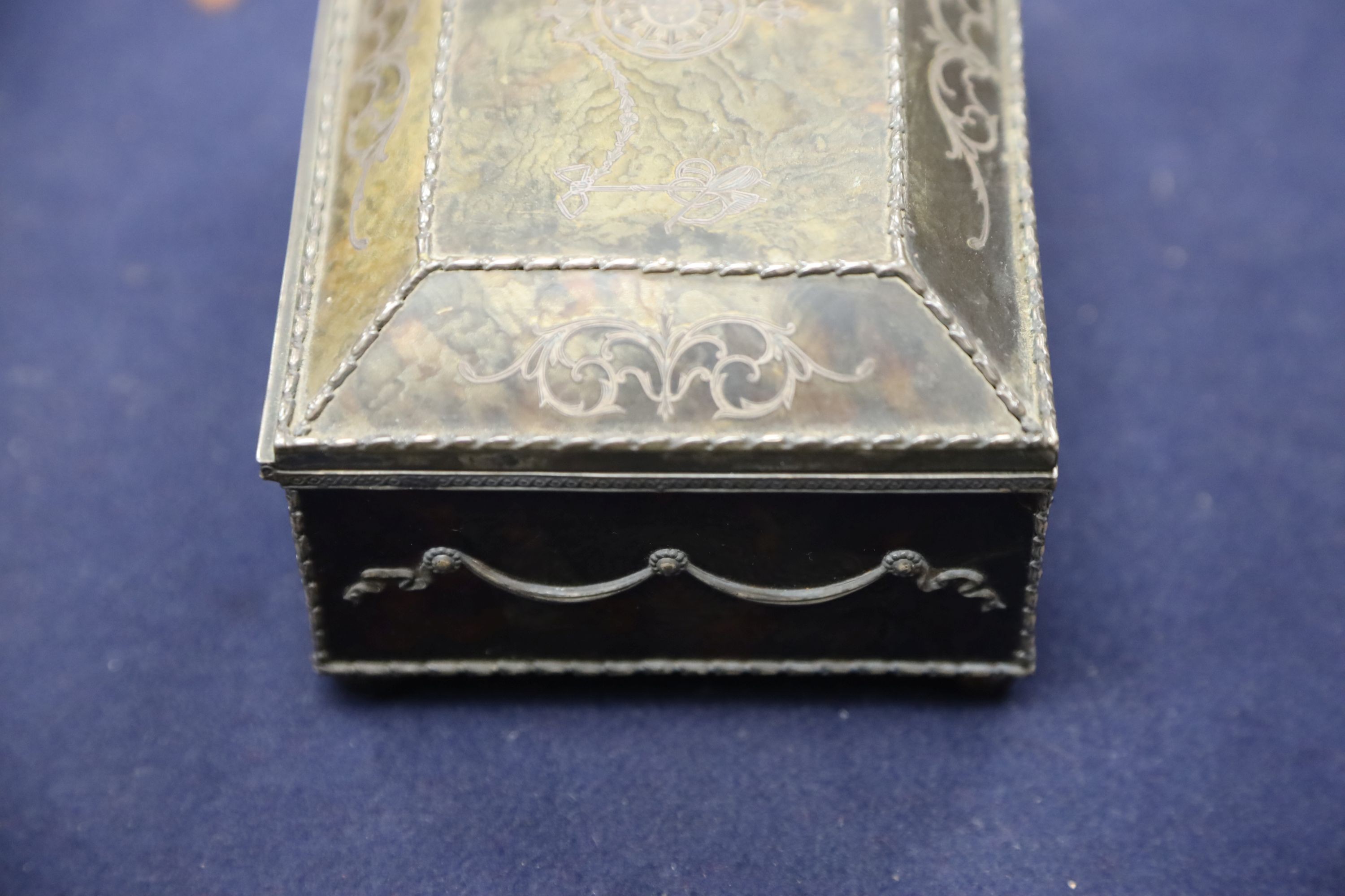 A silver-mounted tortoiseshell pique rectangular trinket box, by William Comyns, raised on four ball feet, London, 1904, width 15cm. 15cm